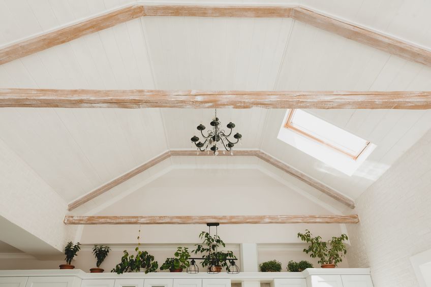 skylight in the living room. white bright living room with a window in the ceiling.